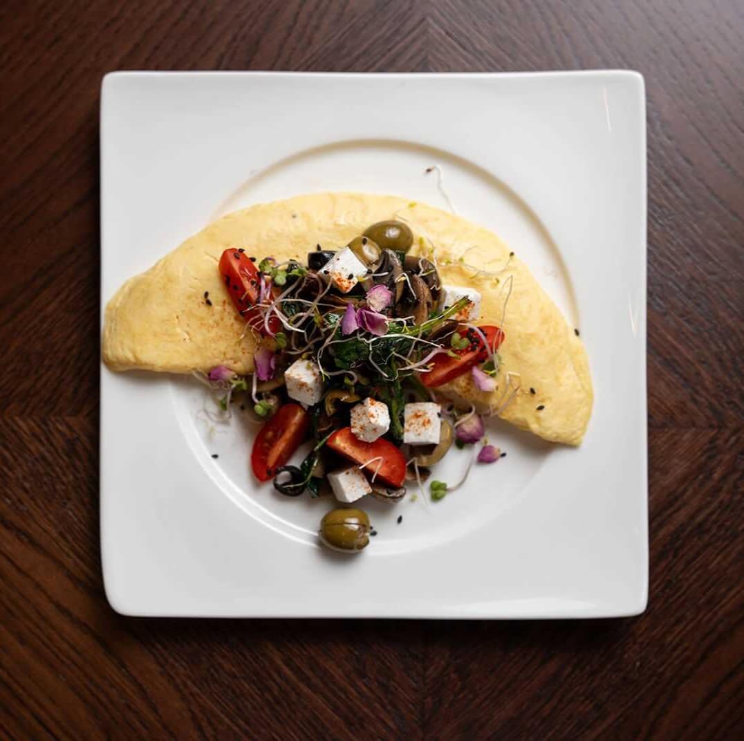 Omelet Roll with selection vegetables with feta cheese