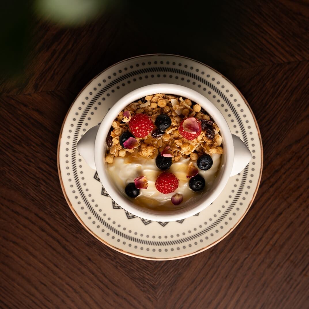 Granola and greek yogurt plain with season fruit